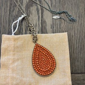 Plunder Teardrop Rust Necklace with gold chain.